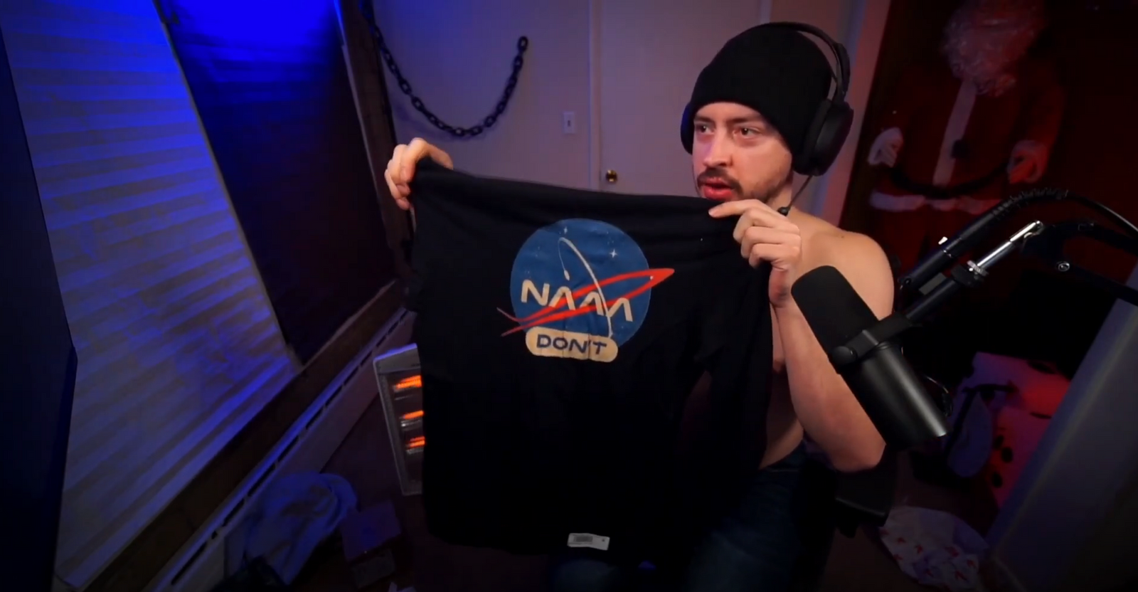 Izidore tries on the NAAA Don't shirt